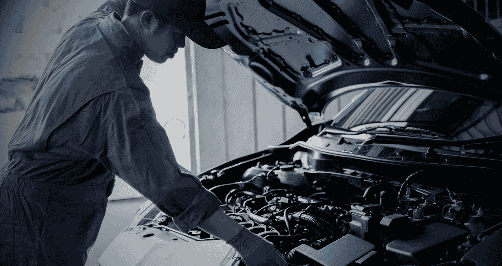 Professional car service in Hamilton with a mechanic inspecting the engine